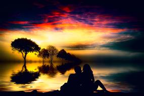 couple in love by the lake on a background of colorful sunset