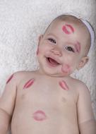 Cute child with the kiss traces on it