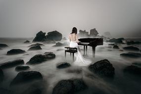 girl in white gown plays Piano on rocky beach, digital art