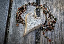 decorative wooden heart on the wooden surface