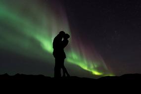 Silhouette of the couple at Northern Lights