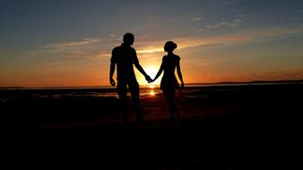 happy romantic couple at sunset