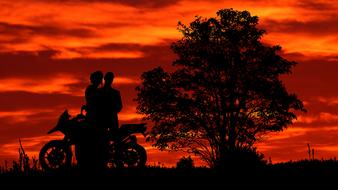 romantic couple on the background of orange sunset