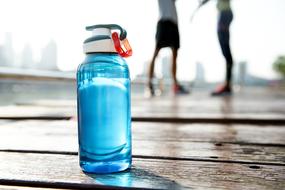 Closeup photo of Bottle Drink on wood