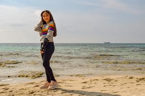 Seascape with the beautiful girl near the water