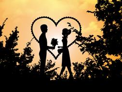 silhouette of a couple in love in the forest on a background of hearts