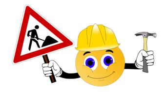 smiley builder with traffic sign and hammer