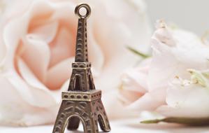 tiny metal model of Eiffel Tower and Roses