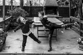 black and white photo of children playing outdoors