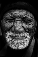 Old dark skin man with grey beard