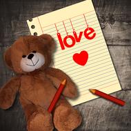 teddy bear, note in love and pencils