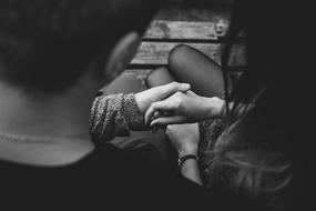 young couple holding hands, black and white