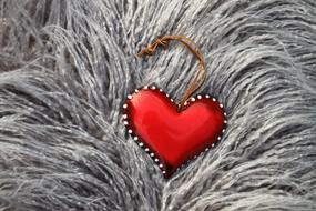 red heart on a fluffy carpet