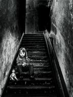 lonely girl sitting on stairs