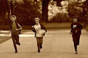 monochrome photo of Boy Child Running