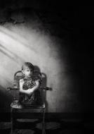 Black and white photo of the girl on the chair