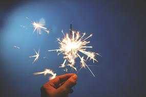 photo of sparklers in hand