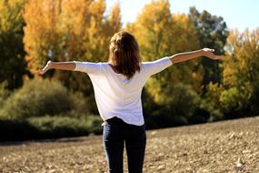 happy girl among nature sunny autumn