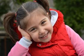 happy child with two ponytails