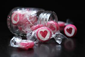 candy with hearts in a transparent jar