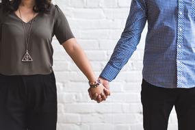 couple in love holding hands close-up