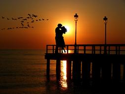 silhouette of lovers at sunset