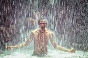 strong Man Under Waterfall