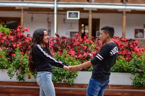 happy couple near flowers