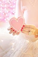 decorative heart in the girl's hand