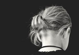 photo of a girl with a short ponytail