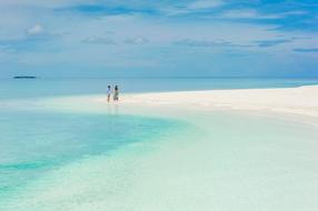 newlyweds on a tropical beach in the Maldives