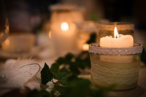 burning candles on a table on a holiday with a blurred background