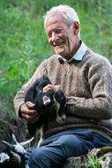 Happy man with the cute goat