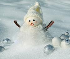 photo of a snowman in a white hat