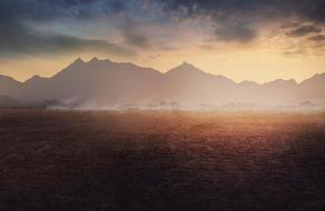 photo of desert on a background of foggy mountains