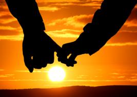 male and female hands at Sunset sky, collage