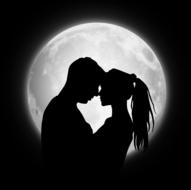 silhouette of a couple in love on the background of the moon