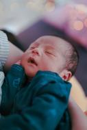 newborn baby in mother's hands