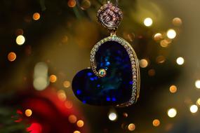 jewelry pendant on a background of Christmas lights