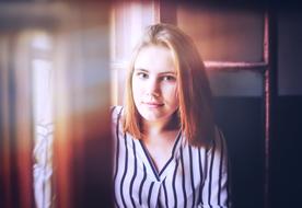 girl sitting near the window