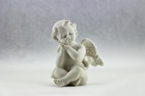 angel with wings as a white figurine