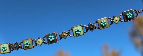 romantic bracelet on a background of blue sky