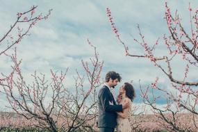 Couple in love in blooming spring garden