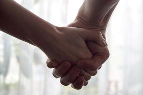 hands and fingers of a couple in love