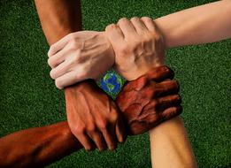 close-knit hands on a green lawn background
