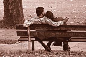 back view of Couple on bench in park