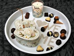 Love me, Valentineâs Day gift box and chocolates on plate