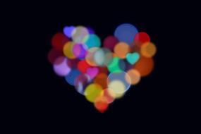 Heart, colorful Bokeh at darkness
