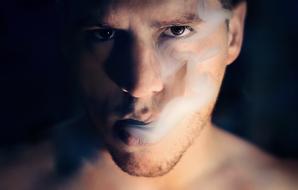 portrait of a smoking confident man