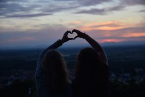 girlfriends made heart out of hand
